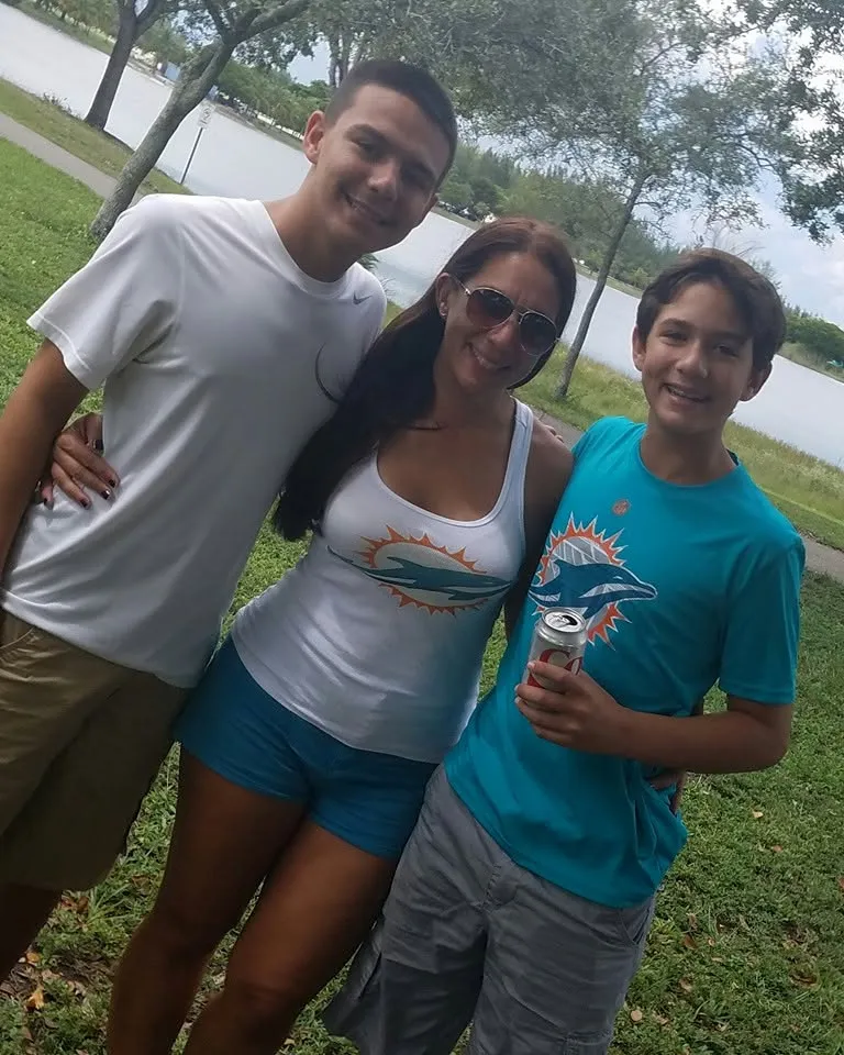 Three classmates at a park picnic
