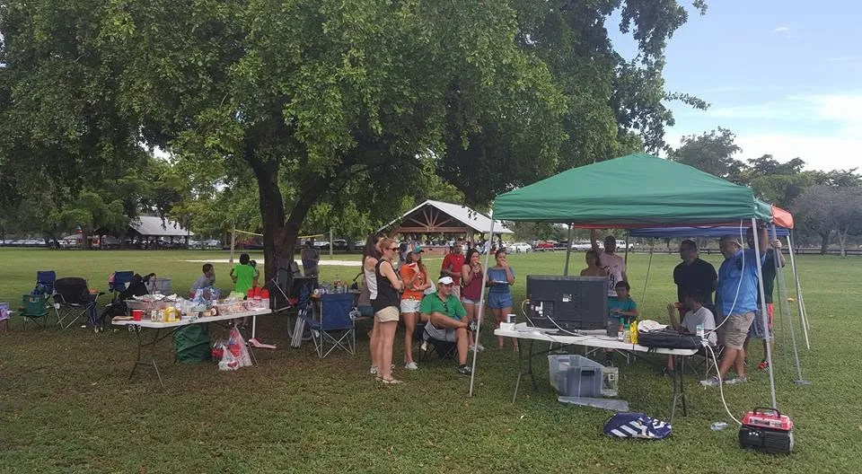 Tents, coolers, and kids at a class picnic