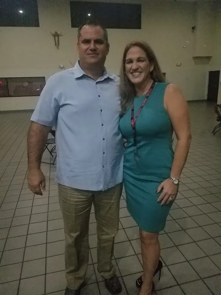 Two classmates at a reunion