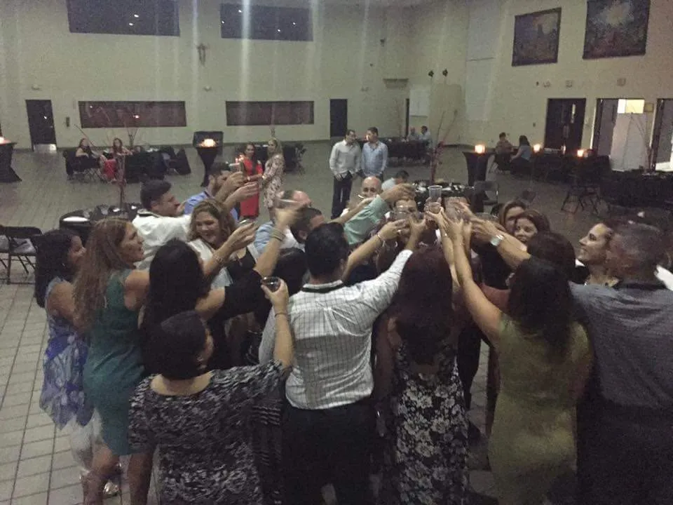 Classmates raising a toast at a reunion