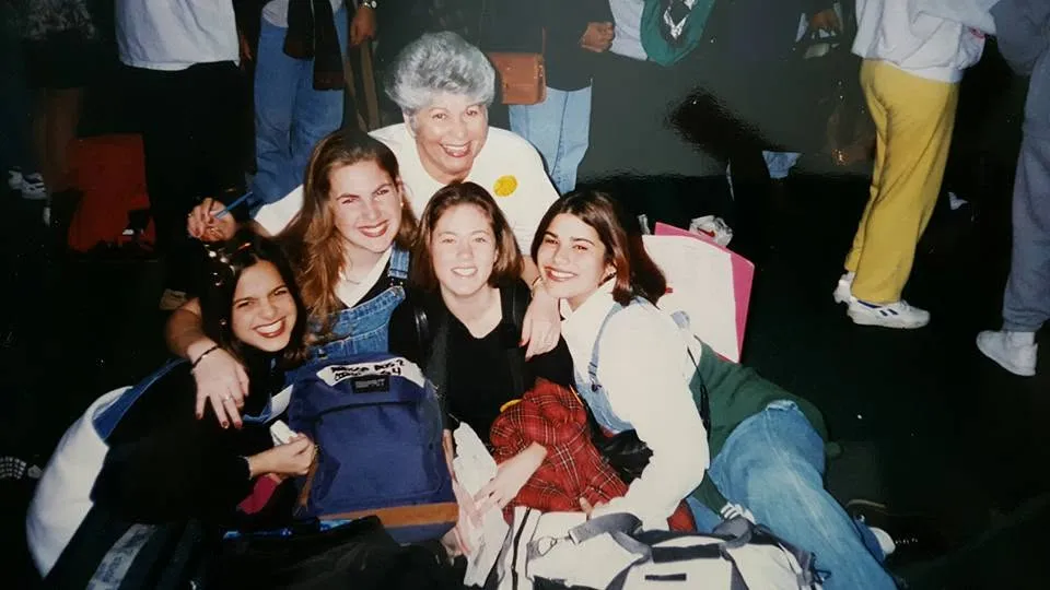 Classmates crowded together on a trip