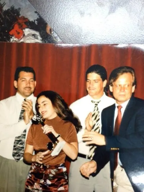 Classmates on stage with a microphone
