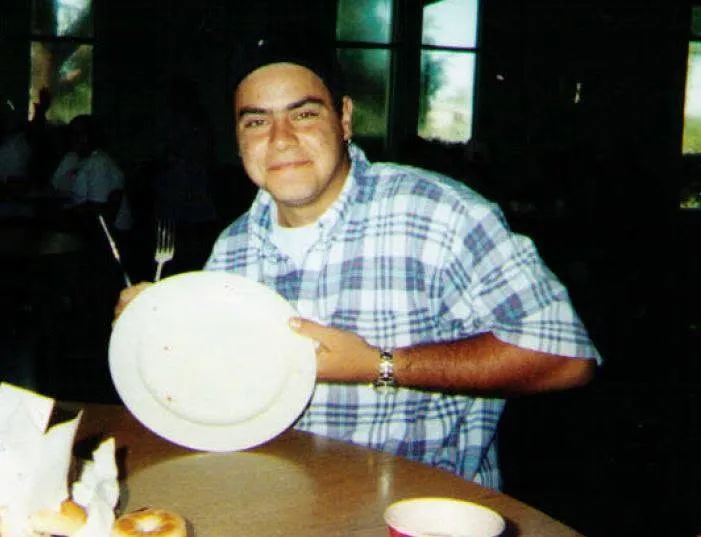 A classmate showing off a paper plate at lunch